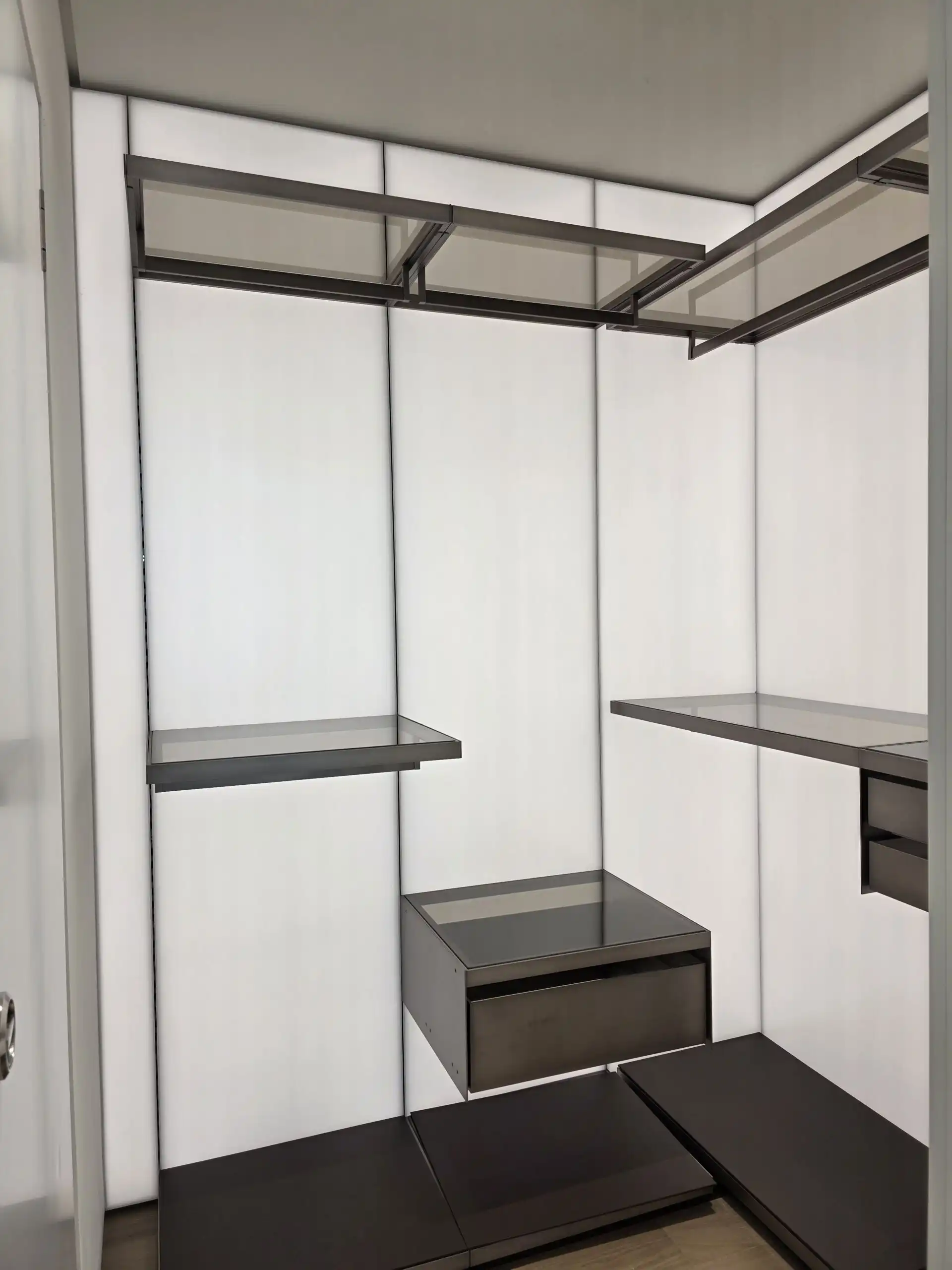 In closet featuring minimalist black and white finishes in Seoul.