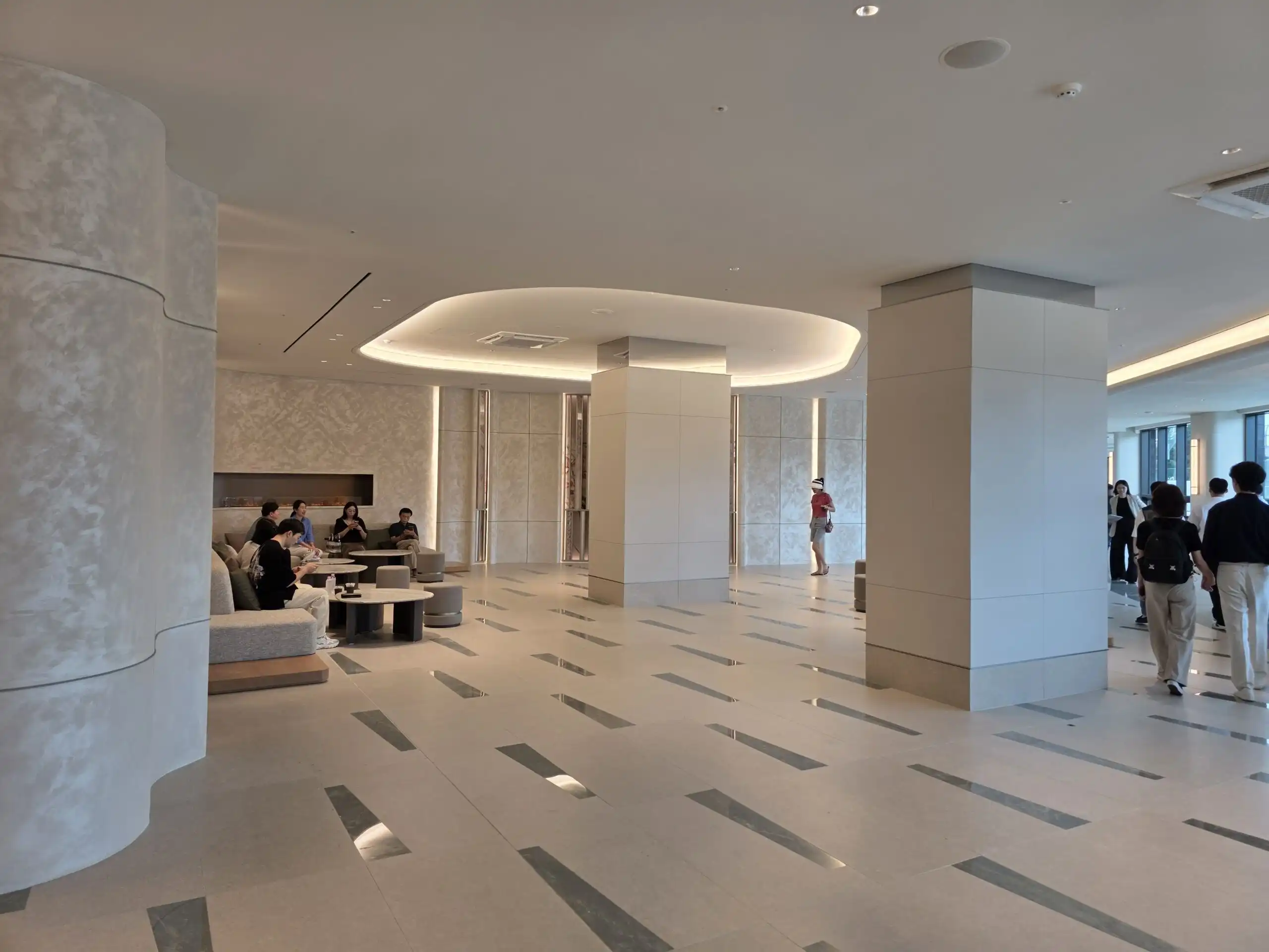 Modern lobby of Pozes Hangang, a prestigious ultra-luxury apartment in Seoul, South Korea.