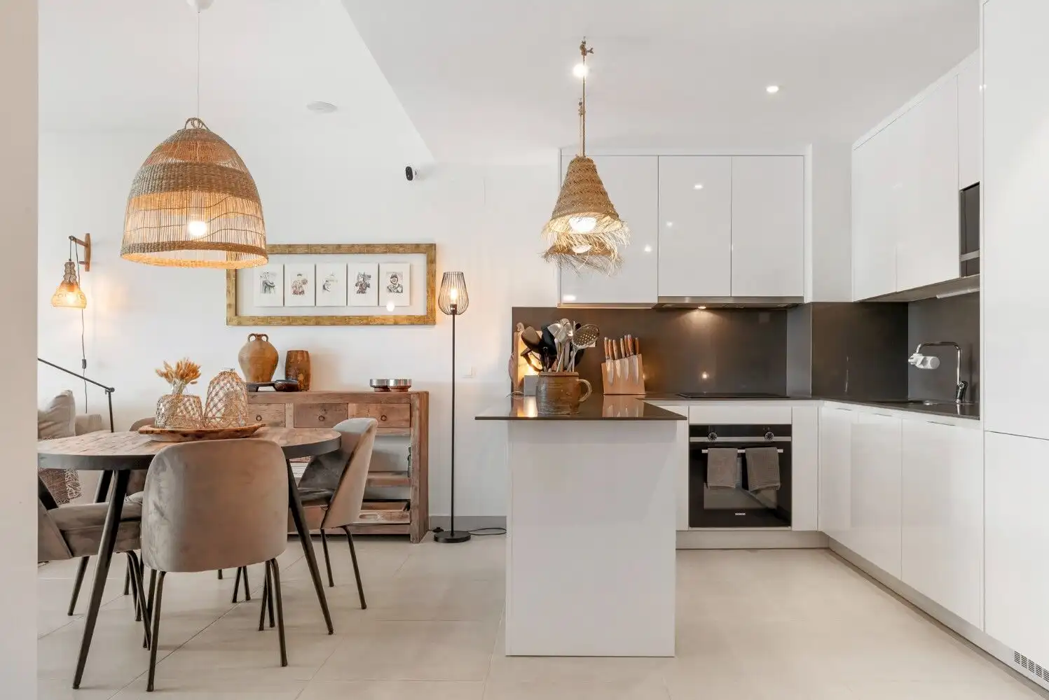 Floor apartment kitchen with sleek white cabinets and contemporary decor.