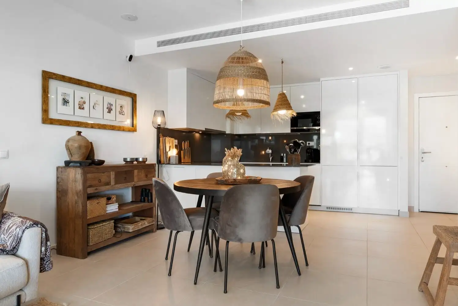 Floor apartment interior with dining area and contemporary decor.