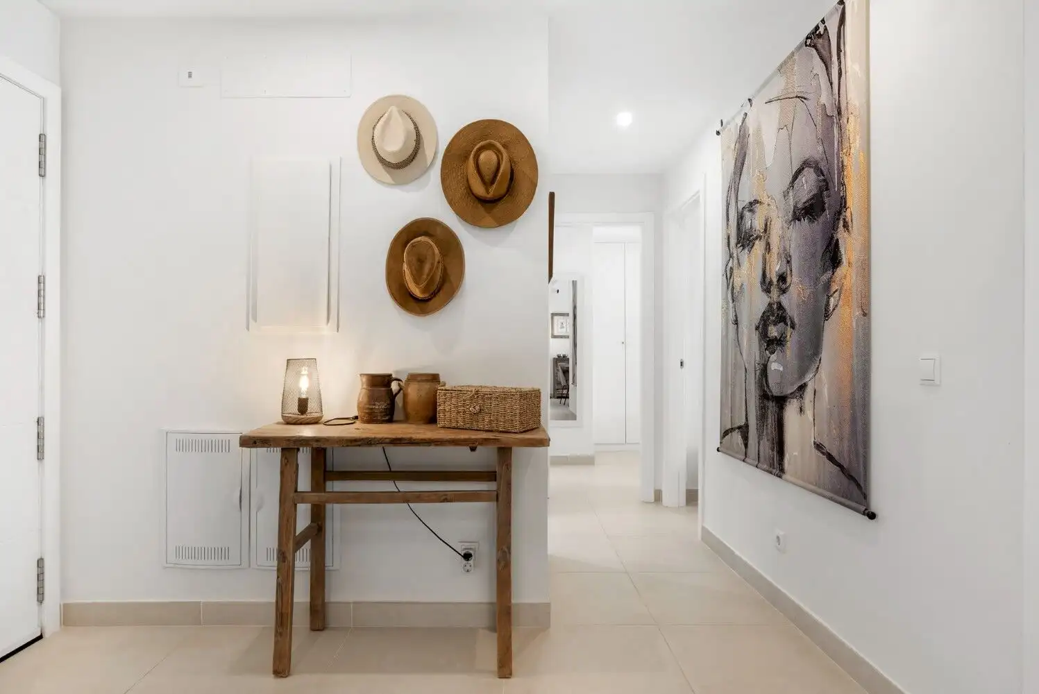 Bright and stylish interior of a contemporary ground-floor apartment with wall art and decorative ha.