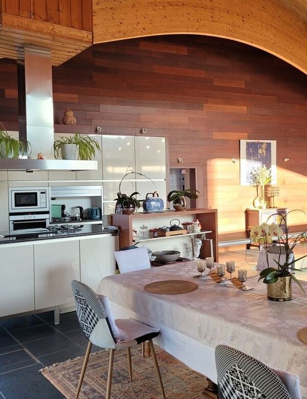 Spacious interior of a 7-bedroom house in Aumagne with modern kitchen and cozy dining area.