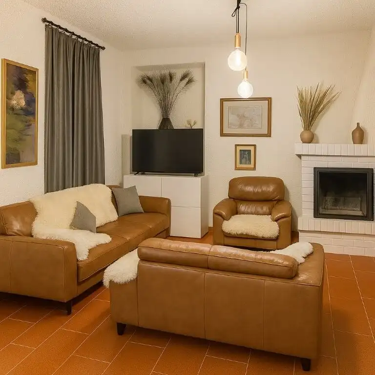 Comfortable living room featuring leather sofas, a fireplace, and elegant decor in a modern home.