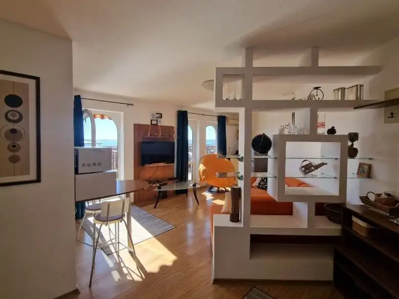 Bright interior of a 1-bedroom sea view apartment with large terrace in Royal Palm, St. Vlas.