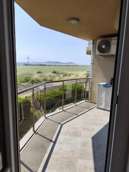 Bright balcony with sea views and outdoor space.