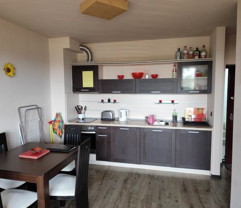 Modern kitchen with dining area in a 1-bed sea view apartment in Ravda, 300m from the sea.