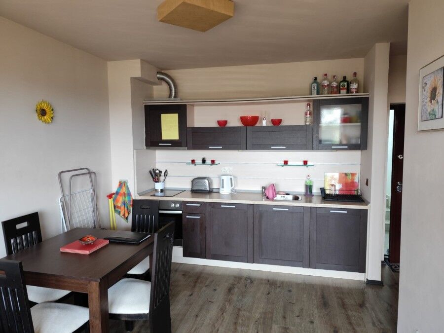 Modern kitchen with dining area in a 1-bed sea view apartment in Ravda, 300m from the sea.