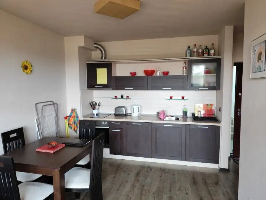 Modern kitchen with dining area in a 1-bed sea view apartment in Ravda, 300m from the sea.