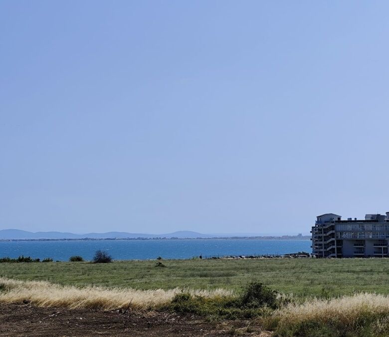 Sea view from SunSet Ravda apartment, 300m from the beach, with open sky and coastal landscape.