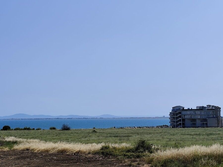 Sea view from SunSet Ravda apartment, 300m from the beach, with open sky and coastal landscape.