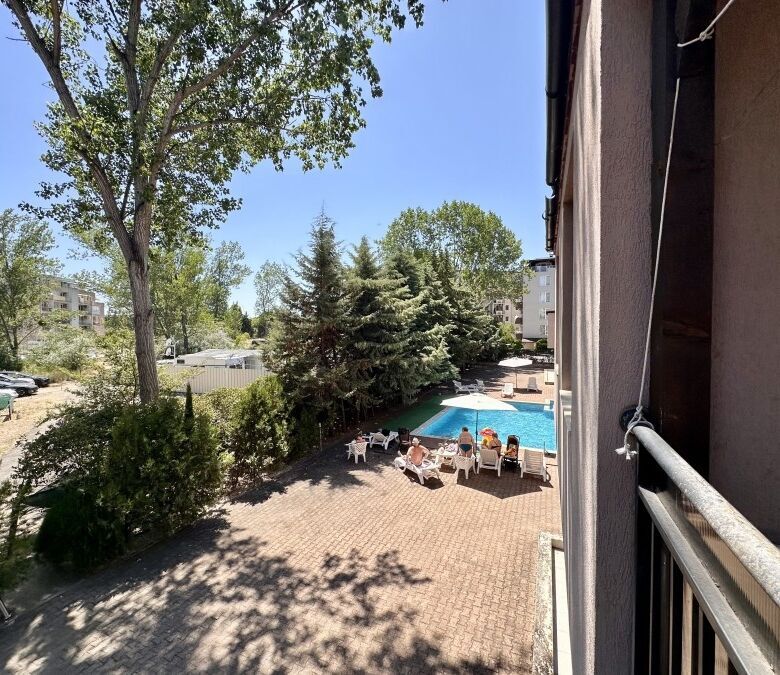 Apartment with pool view and outdoor lounging area in St. Sofia, Sunny Beach.