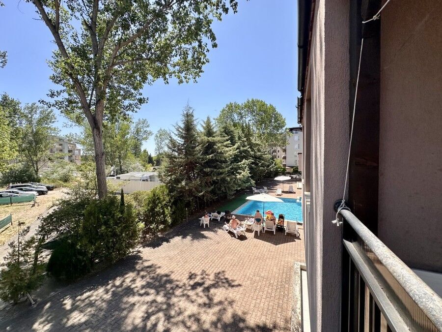 Apartment with pool view and outdoor lounging area in St. Sofia, Sunny Beach.