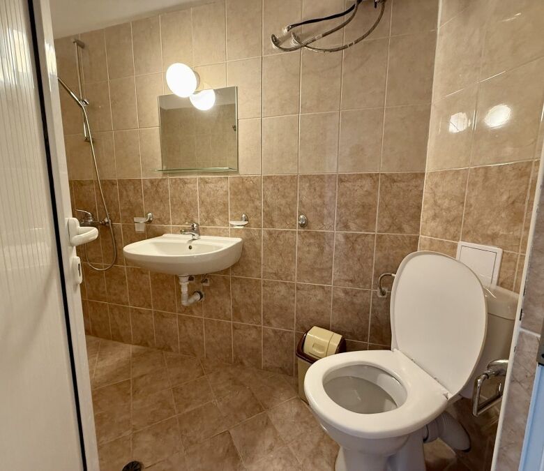 Bathroom with modern fixtures and tiled walls in Ravda, Bulgaria.