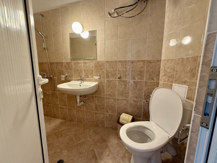 Bathroom with modern fixtures and tiled walls in Ravda, Bulgaria.
