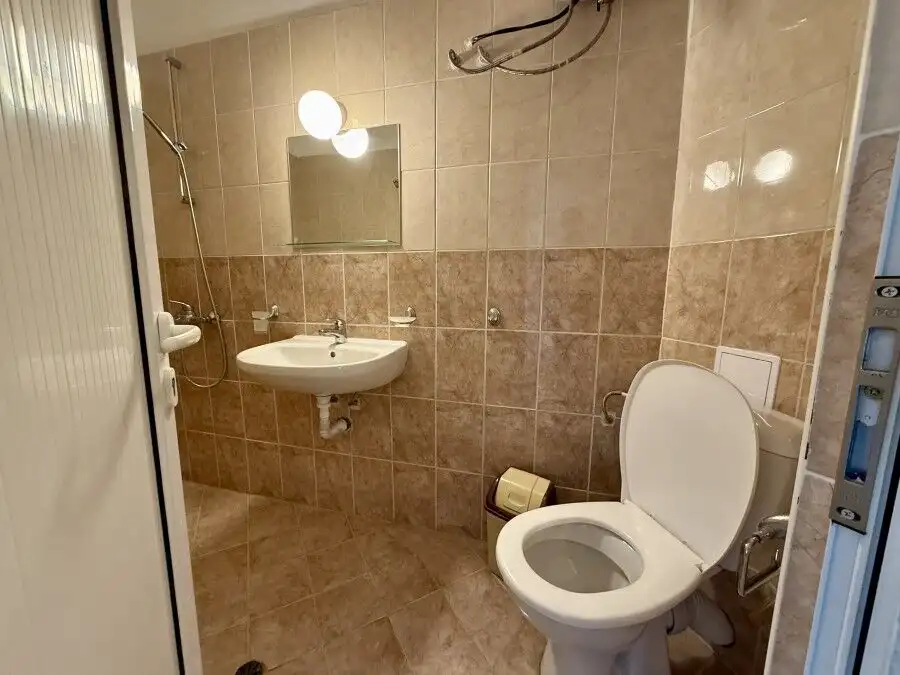 Bathroom with modern fixtures and tiled walls in Ravda, Bulgaria.