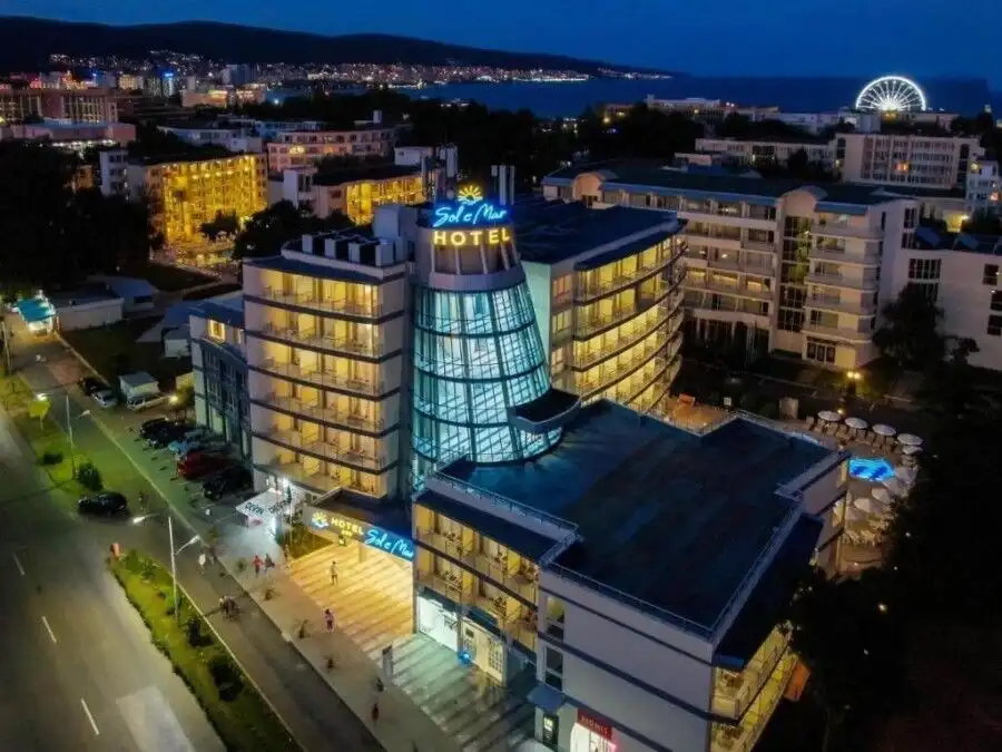 Brightly lit Sol E Mar hotel near Sunny Beach coastline.