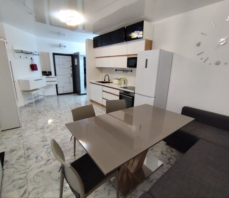 Ground floor 2-bedroom apartment close to Sunny Beach, Bulgaria, with modern kitchen and living area.