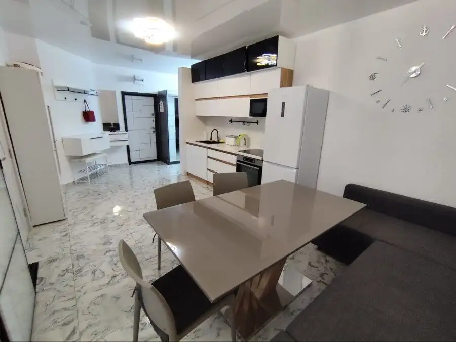 Ground floor 2-bedroom apartment close to Sunny Beach, Bulgaria, with modern kitchen and living area.