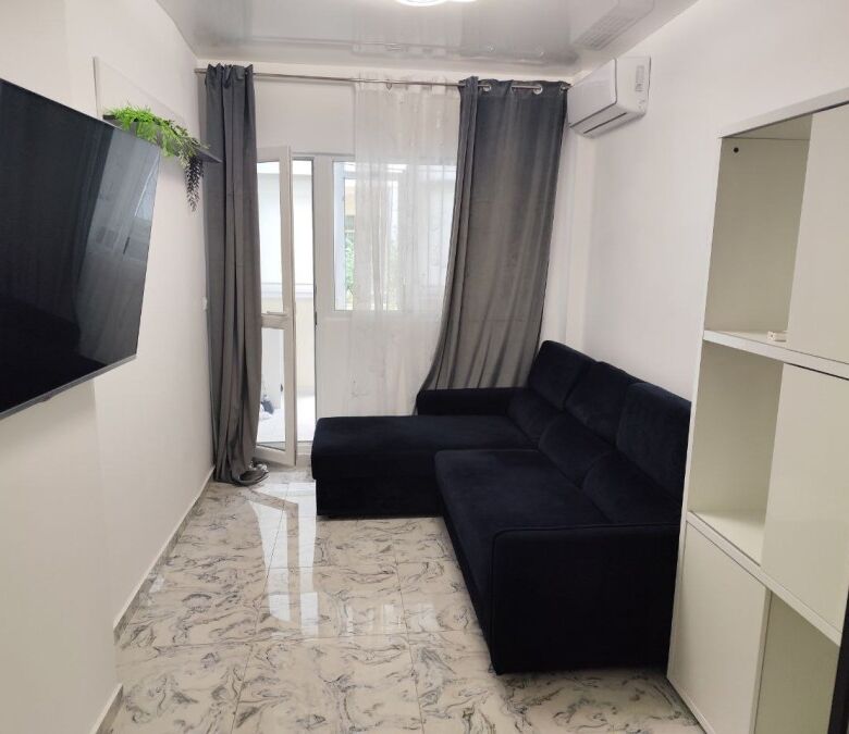 Bright living room with sofa and balcony in Sol E Mar, Sunny Beach.