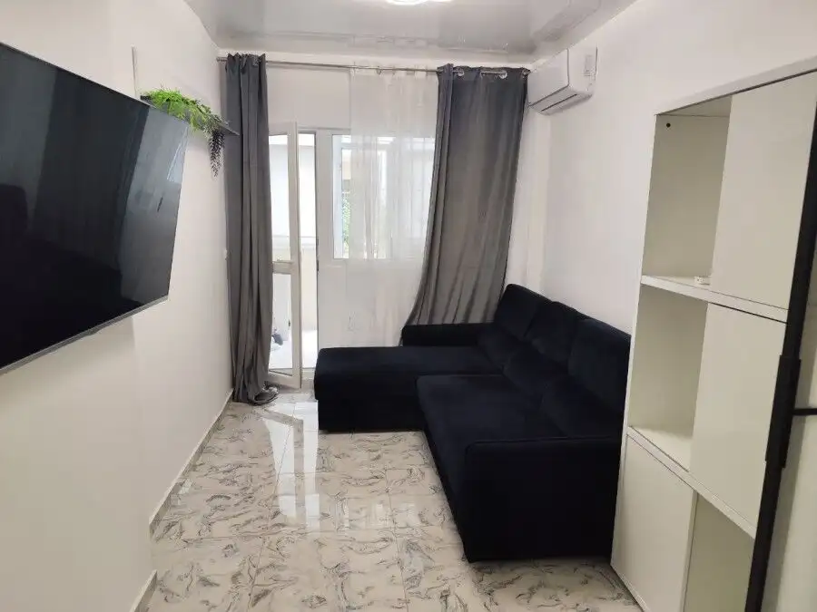 Bright living room with sofa and balcony in Sol E Mar, Sunny Beach.