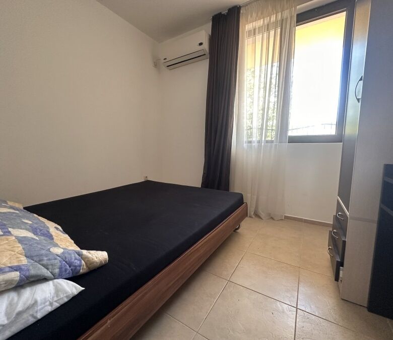 Bright bedroom in sunny apartment with pool access and veranda in Nessebar View complex.