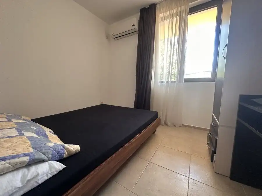 Bright bedroom in sunny apartment with pool access and veranda in Nessebar View complex.