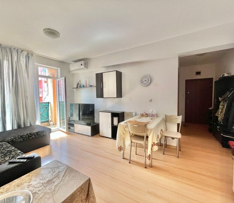 Spacious fully furnished 2-bedroom apartment with bright living area, dining space, and balcony, loc.