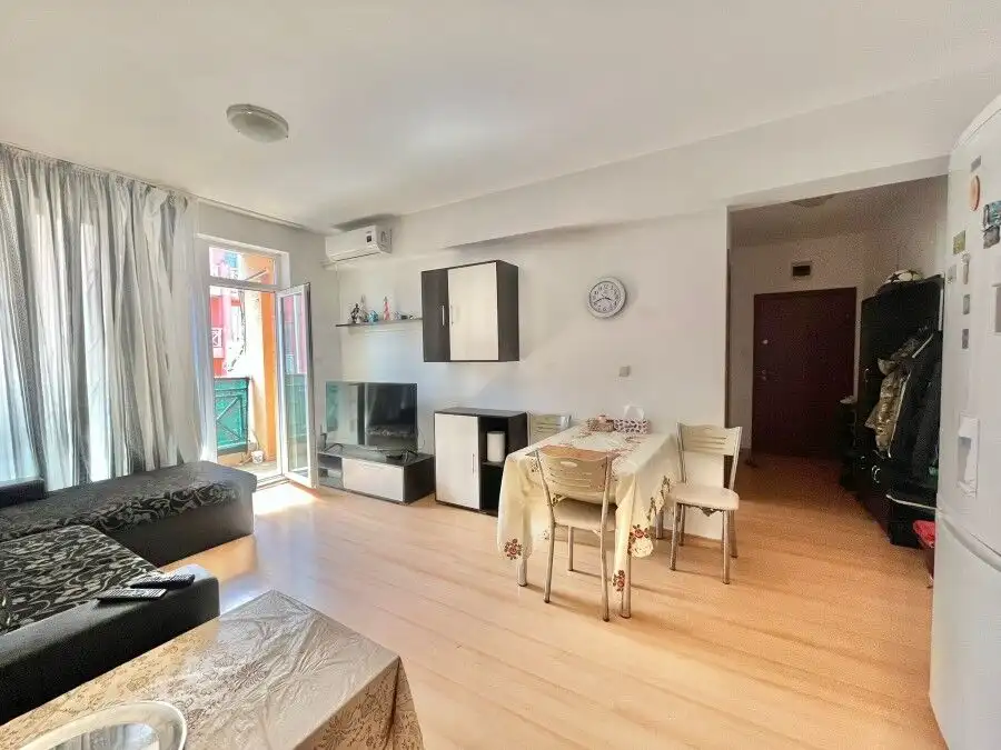 Spacious fully furnished 2-bedroom apartment with bright living area, dining space, and balcony, loc.