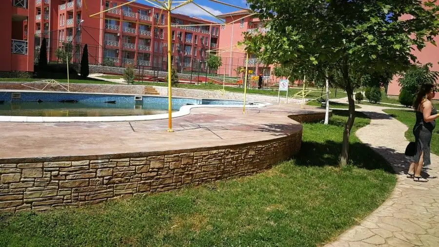 Outdoor pool and green spaces at a contemporary residential community.