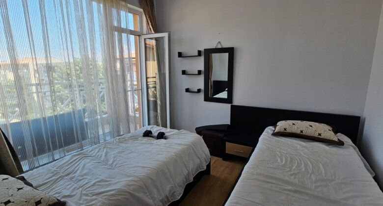 Bright interior of a 2-bedroom top floor apartment with three terraces and panoramic city views.