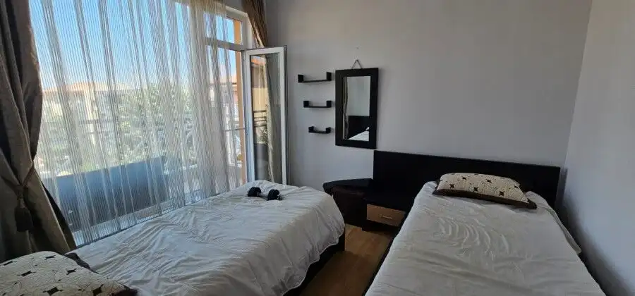 Bright interior of a 2-bedroom top floor apartment with three terraces and panoramic city views.