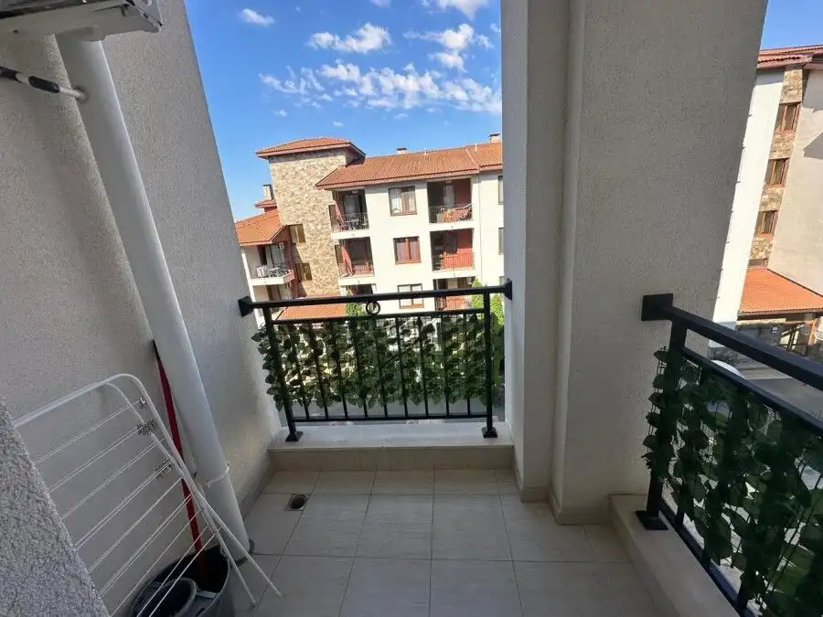 Balcony view of neighboring apartments and blue sky in Ravda, Bulgaria.
