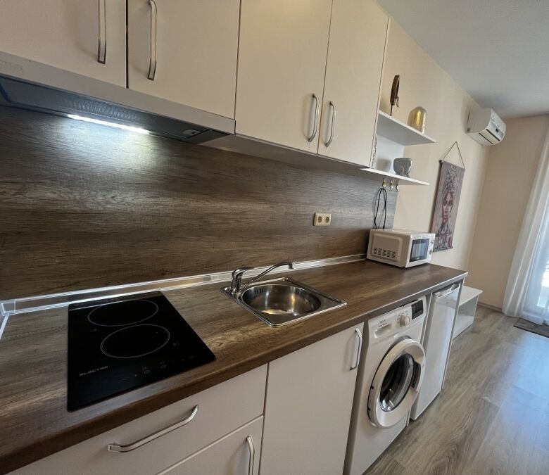 Cozy kitchen with modern appliances in Apollon apartments, Ravda.