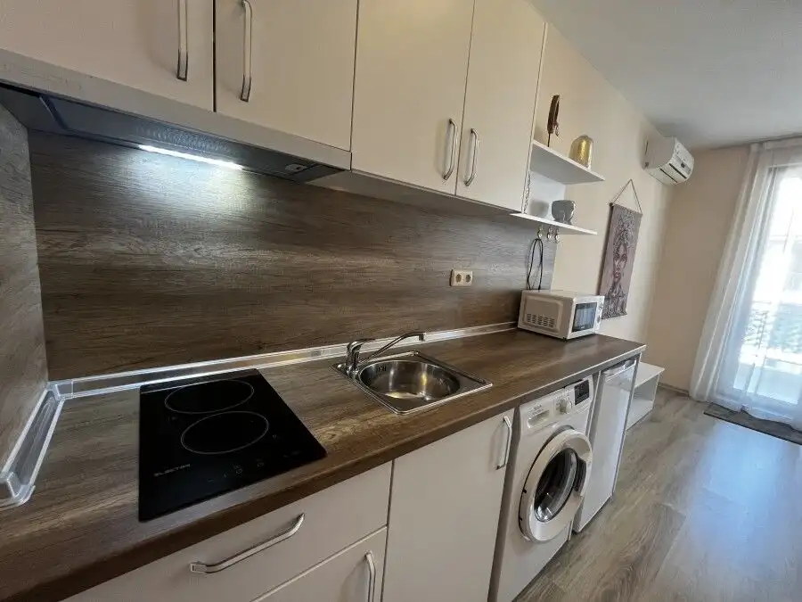 Cozy kitchen with modern appliances in Apollon apartments, Ravda.