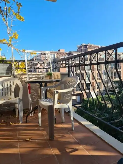 Balcony view of Cascadas Family Resort in Sunny Beach with outdoor seating.