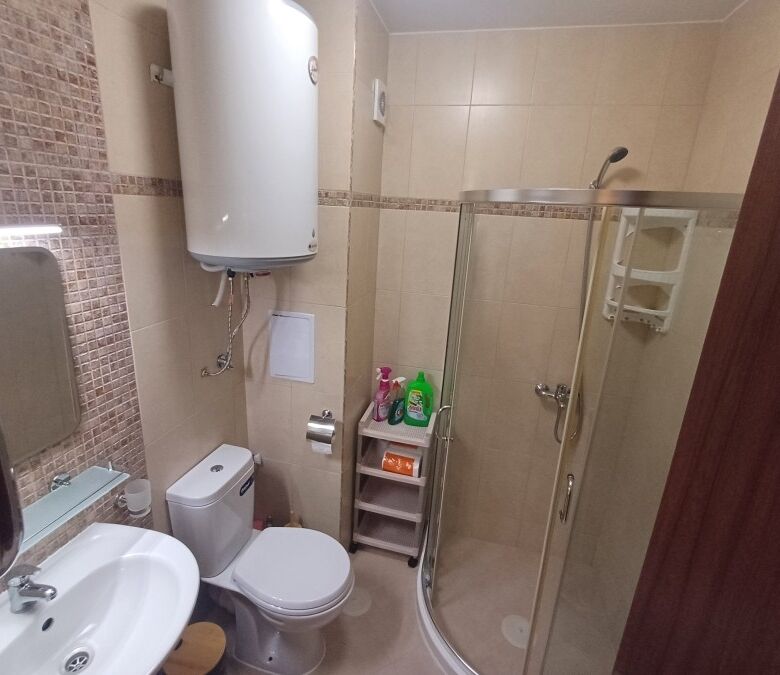 Bright bathroom with shower in Cascadas Family Resort, Sunny Beach, Bulgaria.