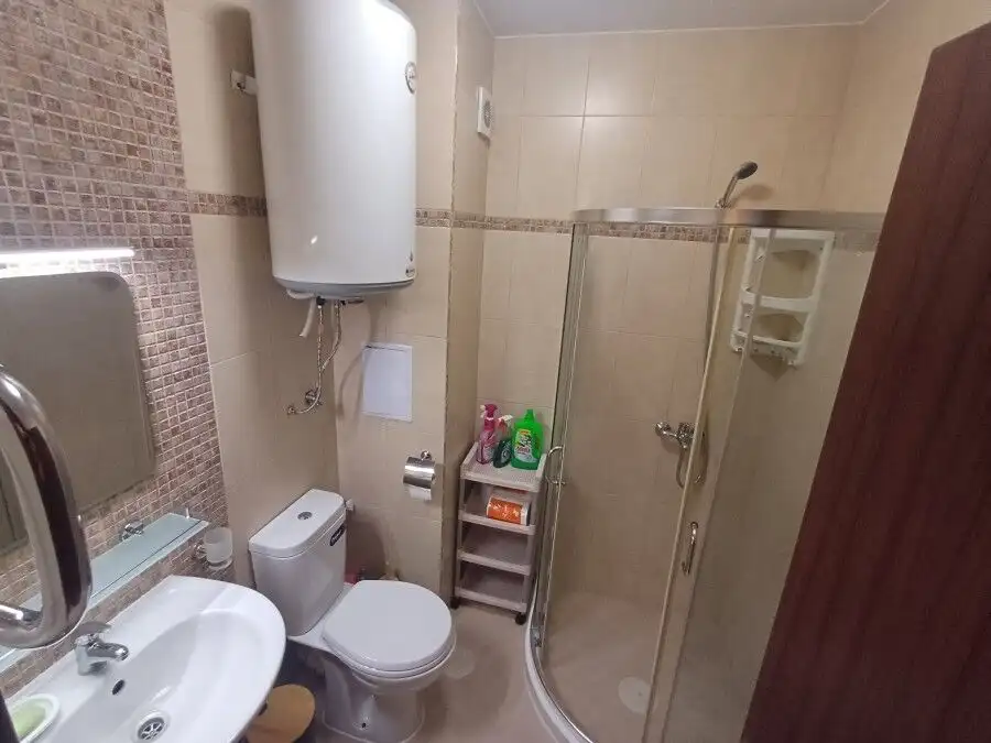 Bright bathroom with shower in Cascadas Family Resort, Sunny Beach, Bulgaria.