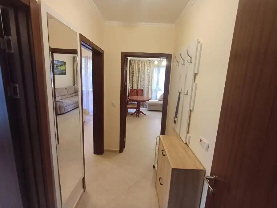 Bright hallway leading to living area with pool view in Cascadas Resort.