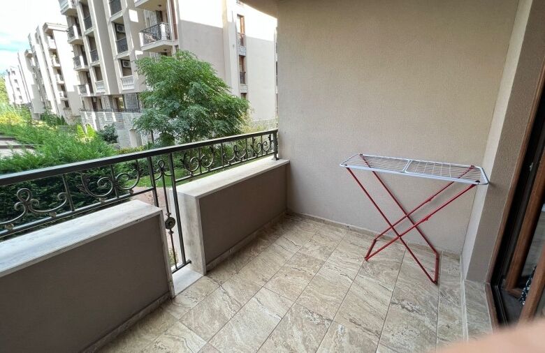 Studio apartment with balcony overlooking greenery in Cascadas Family Resort.