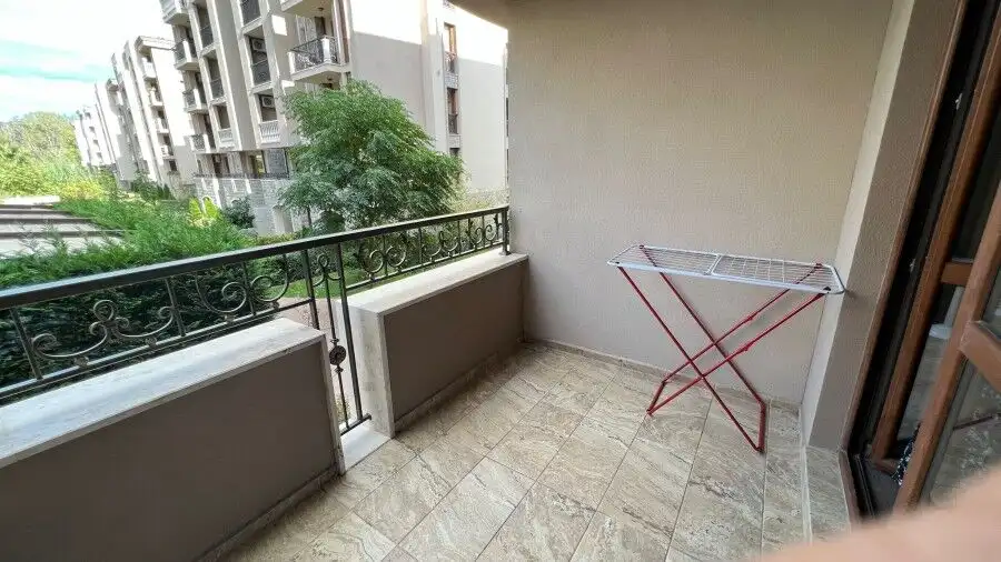 Studio apartment with balcony overlooking greenery in Cascadas Family Resort.