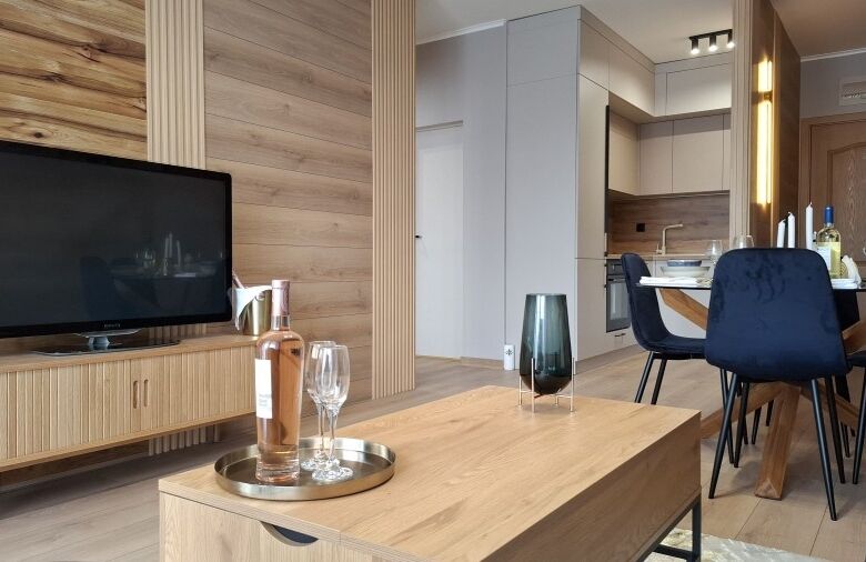 Bright, stylish living space with contemporary furniture and wooden accents.