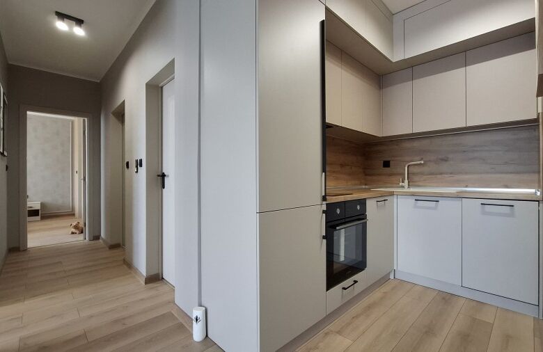Modern kitchen with sleek cabinetry and appliances in a spacious Sunny Beach apartment.