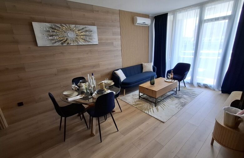 Modern living room with stylish furniture and large windows in Trakia Plaza.