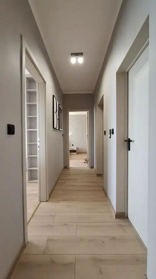 Bright, spacious corridor leading to living areas in a luxurious Trakia Plaza residence.