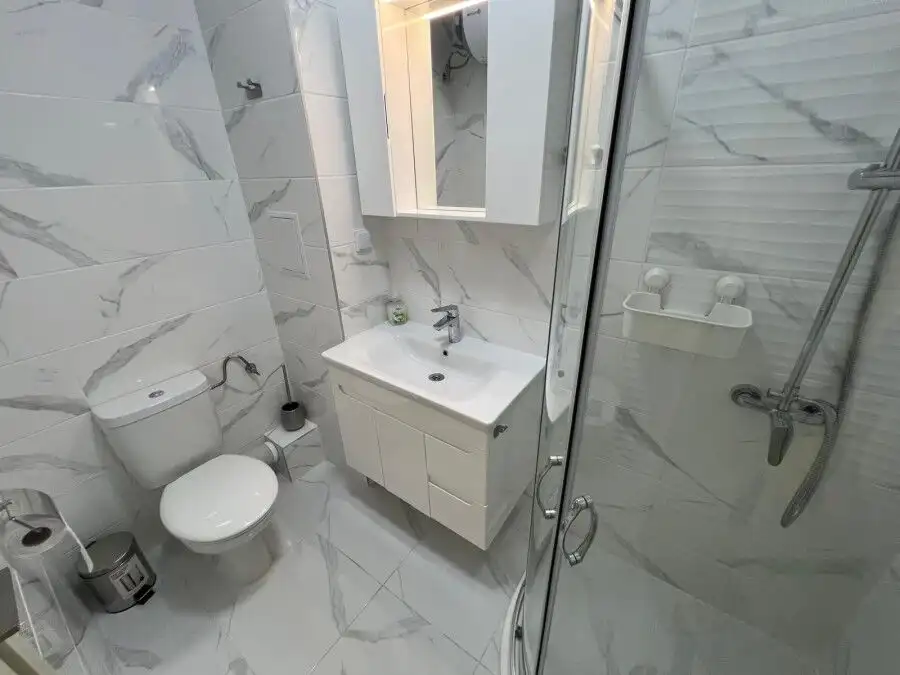 Seaside studio bathroom with modern fixtures in Valencia Gardens complex, Nessebar.