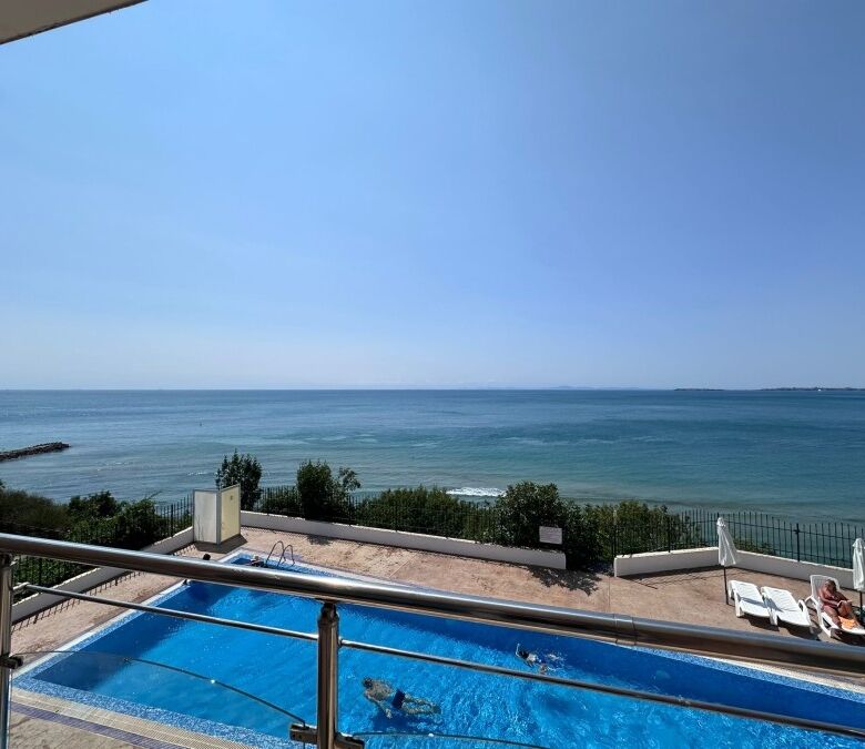 Sea front apartment with pool in Coral Beach, St. Vlas, offering stunning ocean views and modern ame.