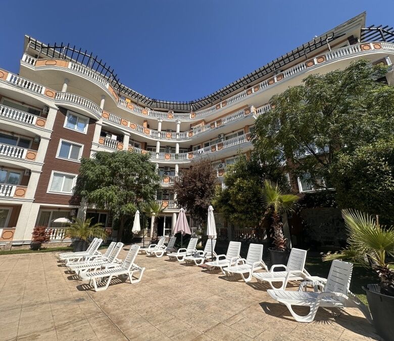 Sunny Beach apartment with pool view and garden access.
