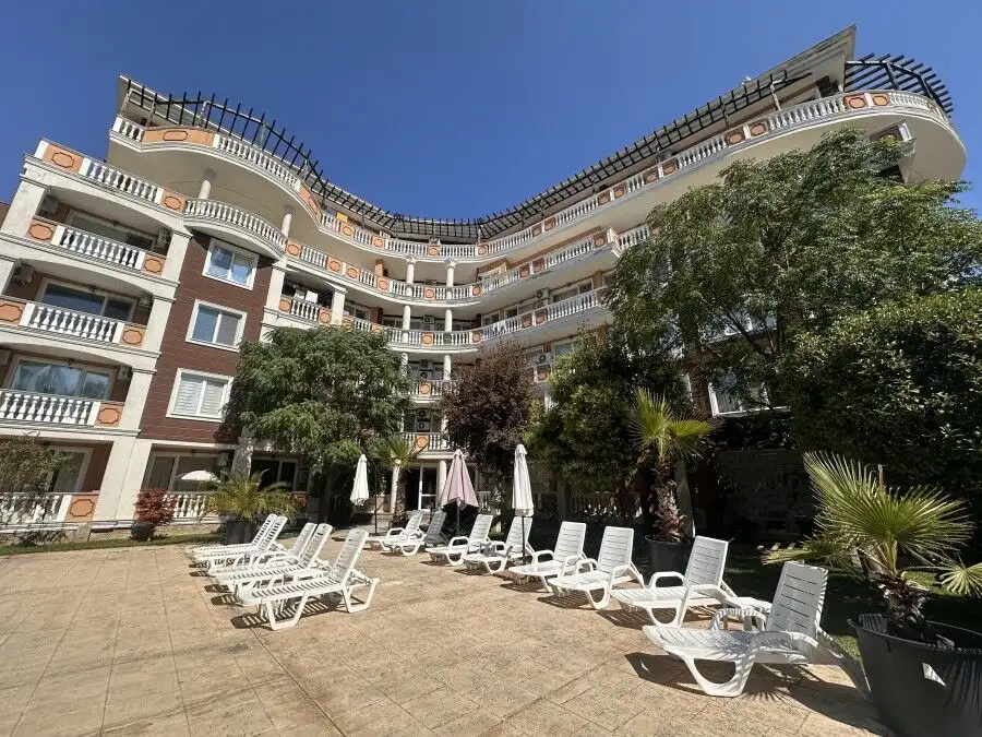 Sunny Beach apartment with pool view and garden access.