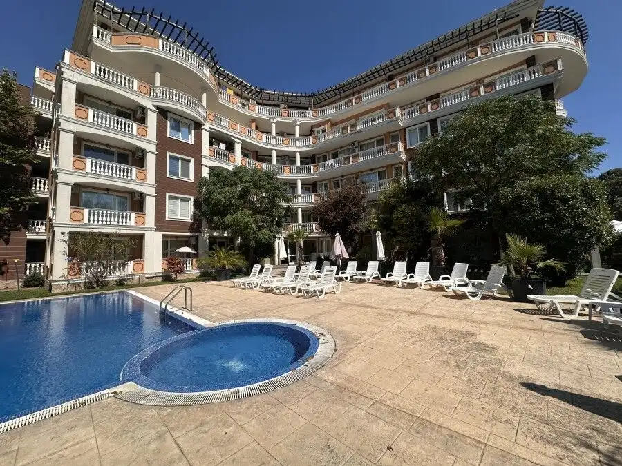 Pool and outdoor lounging area at Villa Aria in Sunny Beach center.