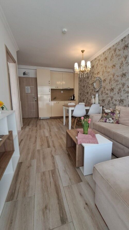 Bright 1-bedroom apartment in Sunny Beach with stylish decor and open-plan living area.